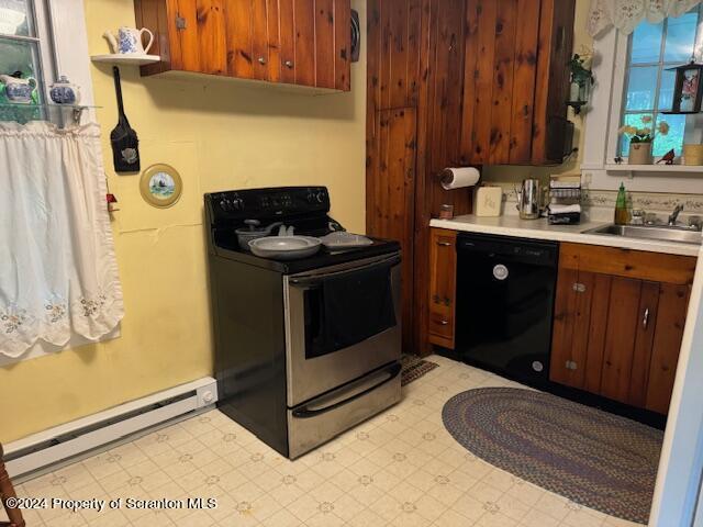 kitchen with baseboard heating, sink, and black appliances