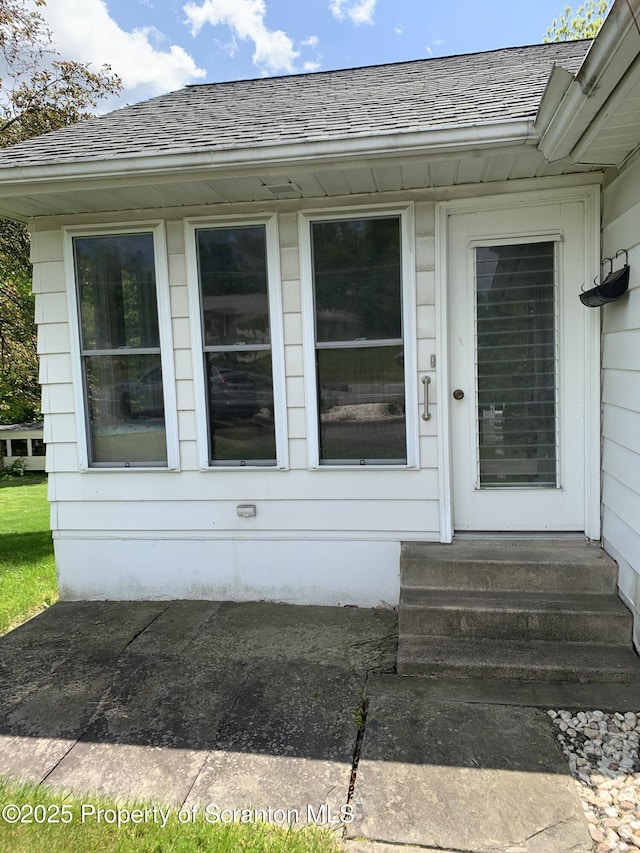 150 Main St, Vandling, PA 18421 - doorway to property featuring roof with shingles