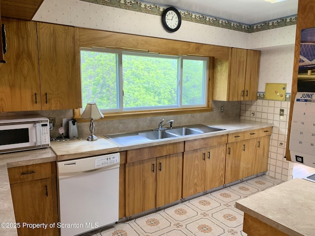 150 Main St, Vandling, PA 18421 - kitchen with white appliances, a sink, light countertops, light floors, and brown cabinetry