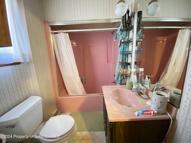 full bathroom featuring shower / tub combo, vanity, and toilet