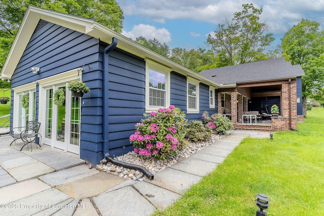 941 Old State Rd, Clarks Summit, PA 18411 - view of side of property with a patio, a lawn, and brick siding