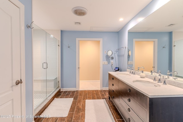 941 Old State Rd, Clarks Summit, PA 18411 - bathroom featuring double vanity, a stall shower, baseboards, wood finished floors, and recessed lighting
