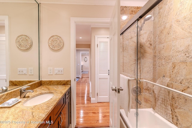941 Old State Rd, Clarks Summit, PA 18411 - full bath featuring wood finished floors, vanity, bath / shower combo with glass door, and ornamental molding
