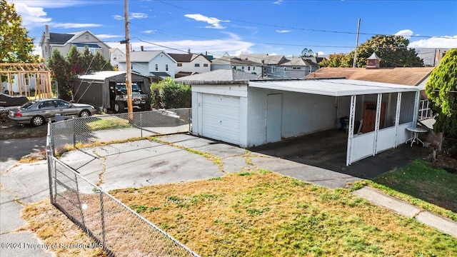 garage featuring a carport