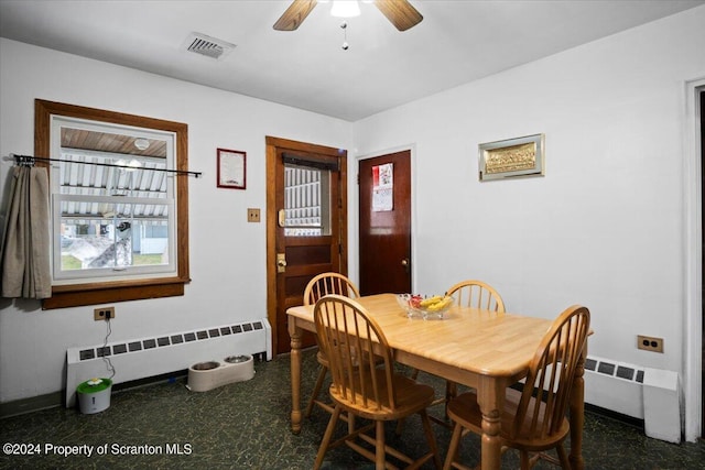 dining area featuring ceiling fan and radiator heating unit