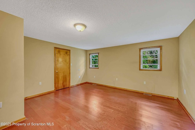331 Drake St, Old Forge, PA 18518 - spare room with light wood-style floors, a textured ceiling, and baseboards