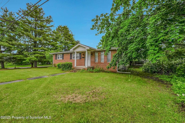 331 Drake St, Old Forge, PA 18518 - view of front of property with brick siding and a front yard