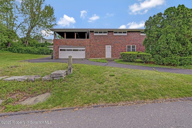 1130 Stafford Ave, Scranton, PA 18504 - view of front of property with driveway, an attached garage, a front yard, and brick siding