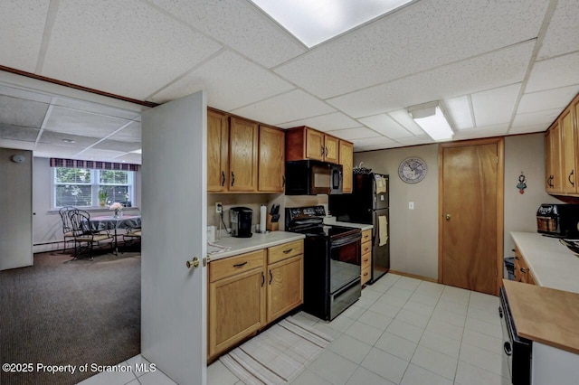 1130 Stafford Ave, Scranton, PA 18504 - kitchen with black appliances, a drop ceiling, light countertops, and brown cabinetry