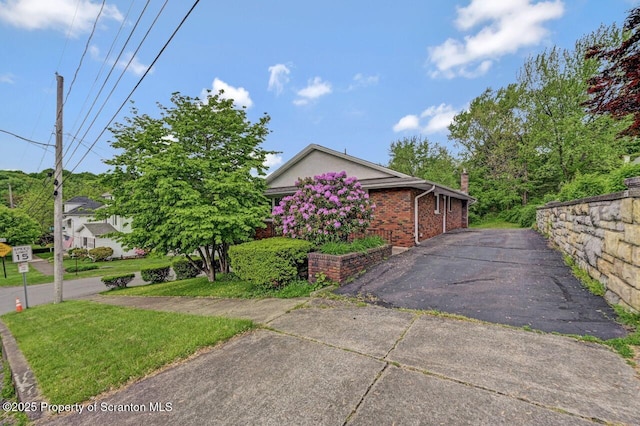 1130 Stafford Ave, Scranton, PA 18504 - view of side of property with asphalt driveway and brick siding