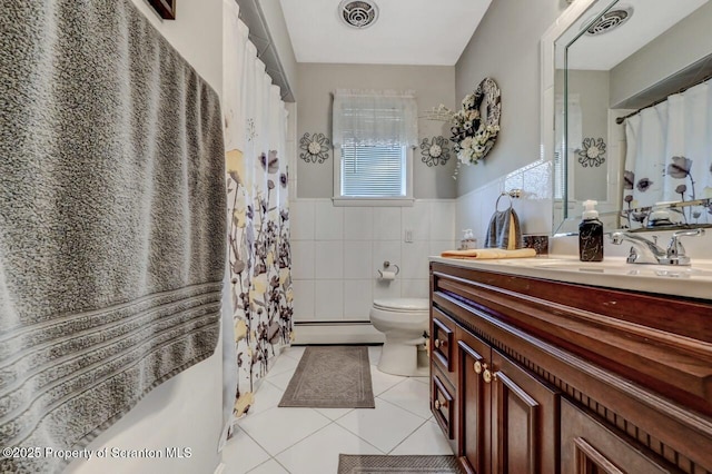 1130 Stafford Ave, Scranton, PA 18504 - bathroom with tile patterned flooring, toilet, a baseboard heating unit, tile walls, and vanity