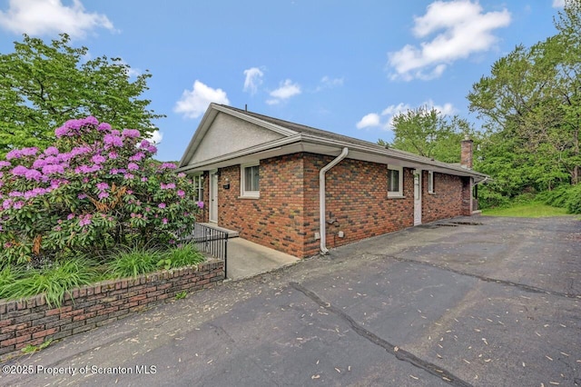 1130 Stafford Ave, Scranton, PA 18504 - view of side of property with brick siding and a chimney