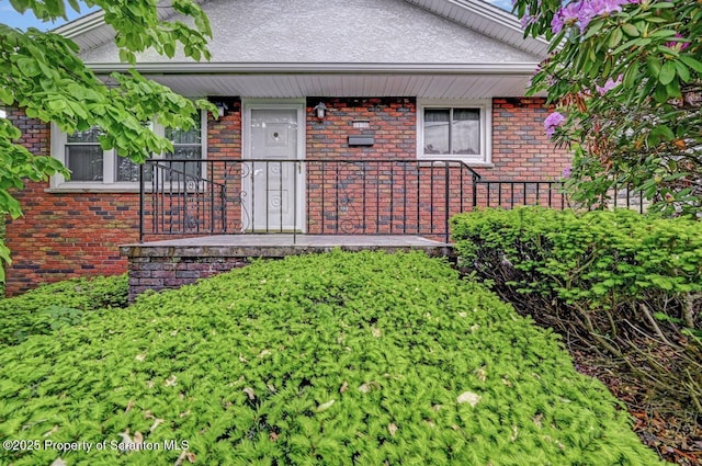 1130 Stafford Ave, Scranton, PA 18504 - view of front facade with a porch and brick siding
