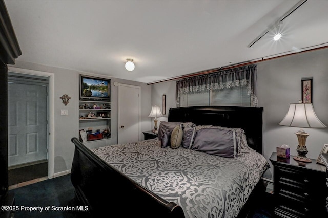 1130 Stafford Ave, Scranton, PA 18504 - bedroom featuring track lighting, baseboards, and dark carpet