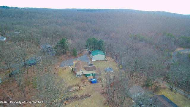 bird's eye view featuring a view of trees