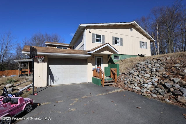 view of front of house featuring an attached garage and driveway