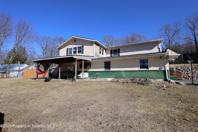 rear view of property with fence