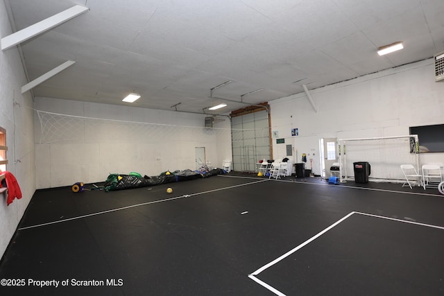 garage with concrete block wall