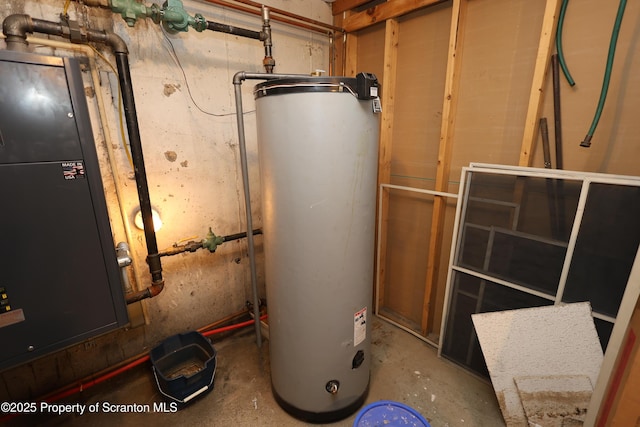 utility room featuring water heater