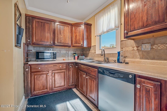 kitchen with tasteful backsplash, sink, ornamental molding, and stainless steel appliances