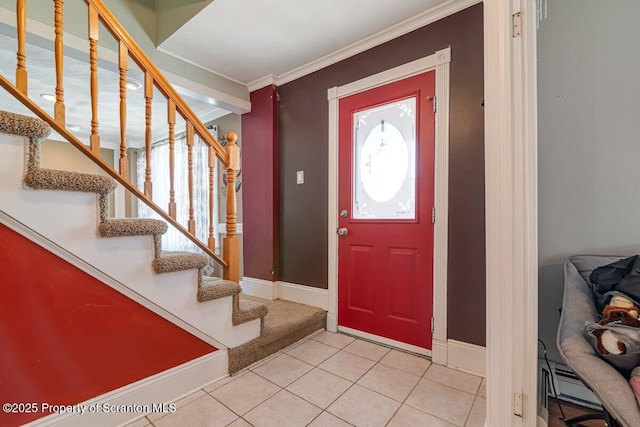 tiled entrance foyer featuring ornamental molding