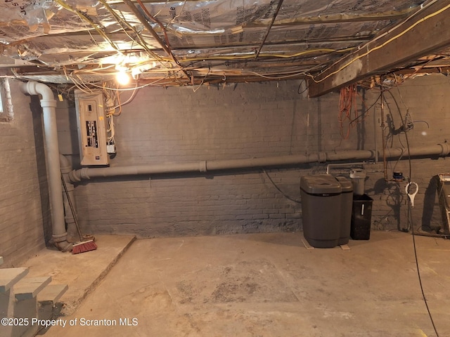 unfinished below grade area with electric panel