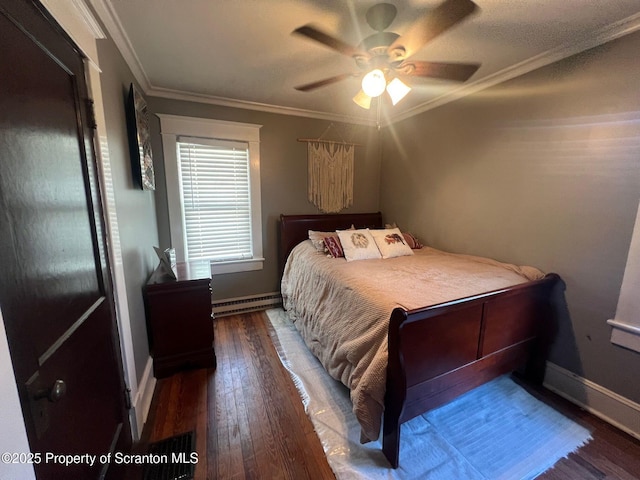 bedroom with a ceiling fan, baseboards, a baseboard heating unit, ornamental molding, and hardwood / wood-style floors