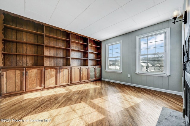 empty room with light hardwood / wood-style floors