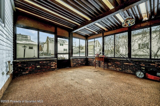 unfurnished sunroom with a wealth of natural light