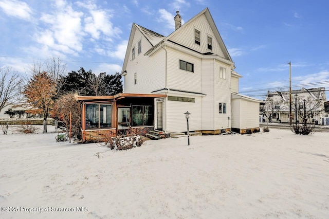 view of snow covered property