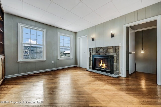 unfurnished living room featuring hardwood / wood-style floors and a fireplace