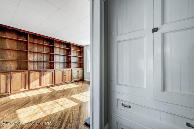 interior space featuring hardwood / wood-style floors and built in features