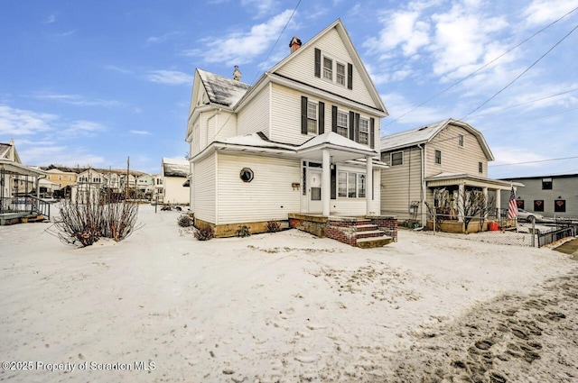 view of snow covered house