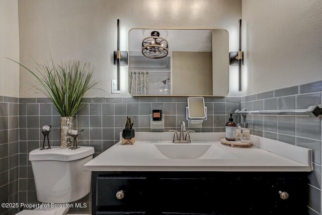 bathroom with toilet and vanity