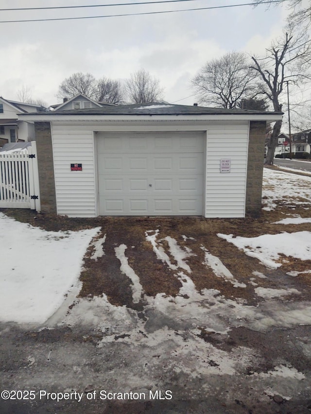 view of snow covered garage