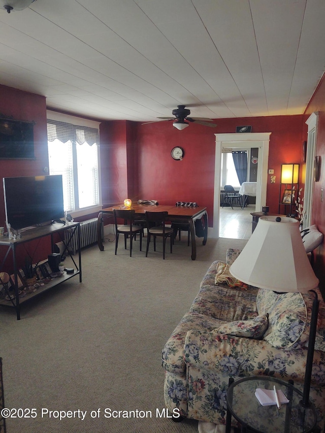 living room featuring radiator heating unit and carpet flooring