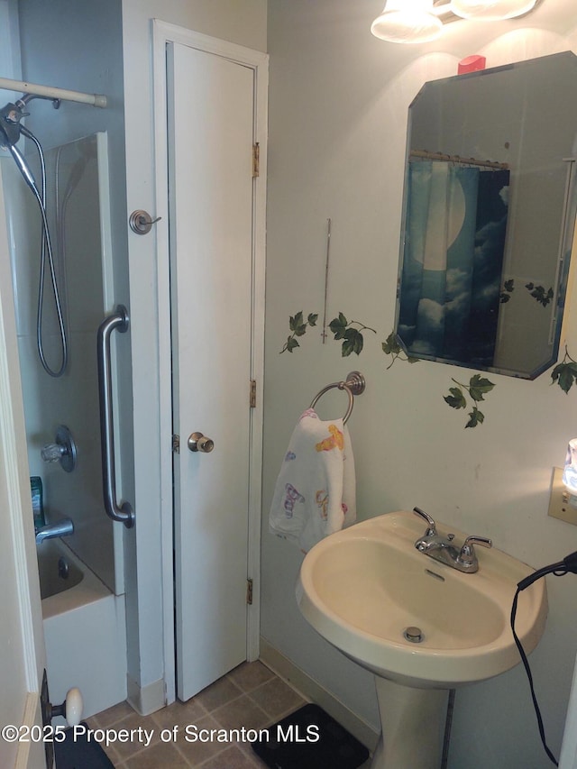 bathroom with sink, tile patterned floors, and shower / bath combo with shower curtain