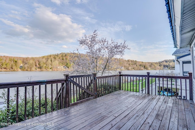 446 Lake Rd, Nicholson, PA 18446 - deck with a forest view and a water view