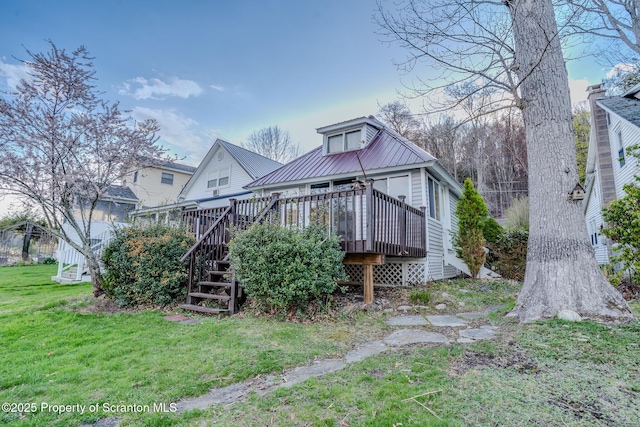 446 Lake Rd, Nicholson, PA 18446 - rear view of property featuring a lawn, stairway, a deck, and metal roof