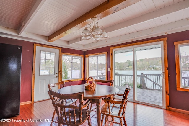 446 Lake Rd, Nicholson, PA 18446 - dining space with beamed ceiling, wood-type flooring, an inviting chandelier, and baseboards