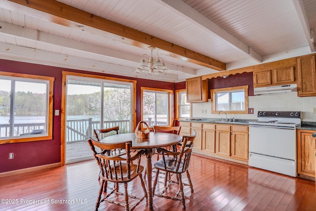 446 Lake Rd, Nicholson, PA 18446 - dining space with light wood-style floors, a notable chandelier, beamed ceiling, and baseboards
