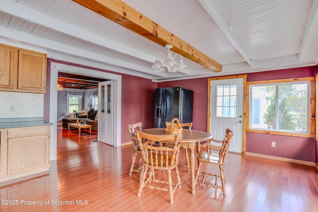 446 Lake Rd, Nicholson, PA 18446 - dining room with beamed ceiling, plenty of natural light, an inviting chandelier, and baseboards