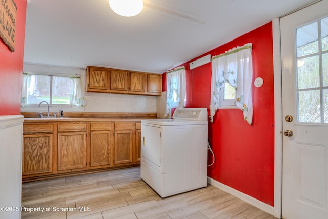446 Lake Rd, Nicholson, PA 18446 - laundry area with light wood-style flooring, a wealth of natural light, washer / clothes dryer, and a sink