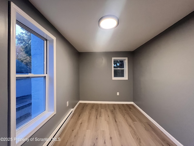 unfurnished room with light hardwood / wood-style flooring