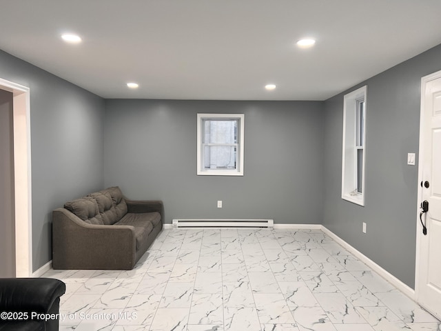 living area with baseboard heating