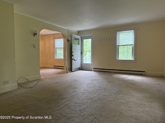 308 Marion St, Clarks Summit, PA 18411 - unfurnished room featuring arched walkways, ornamental molding, a baseboard radiator, carpet, and baseboards