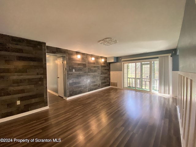 empty room featuring dark hardwood / wood-style floors