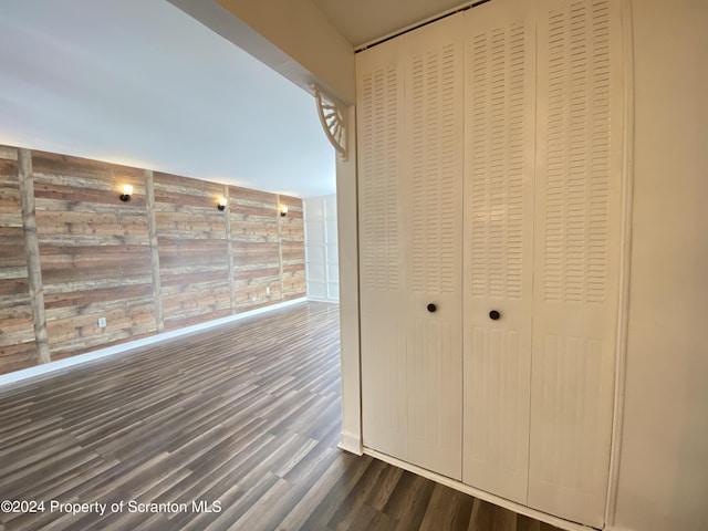 hallway featuring dark hardwood / wood-style flooring