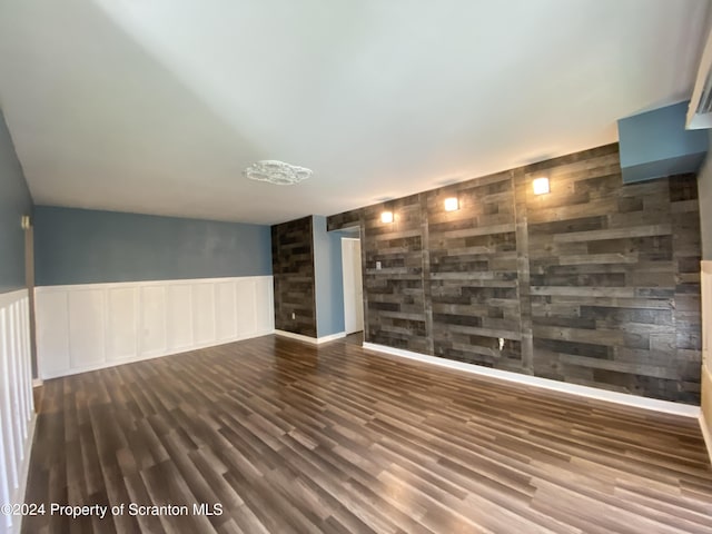 spare room with dark hardwood / wood-style floors