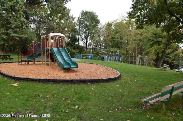 view of playground with a yard